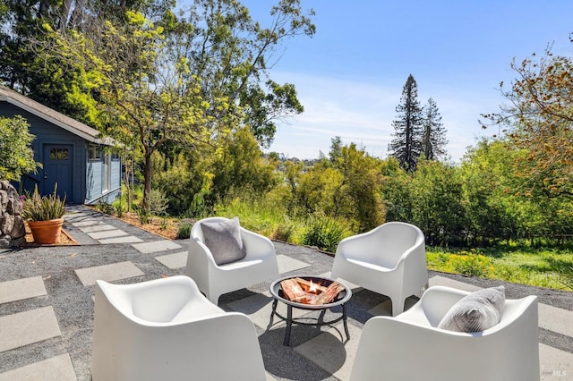 view of patio with an outdoor fire pit
