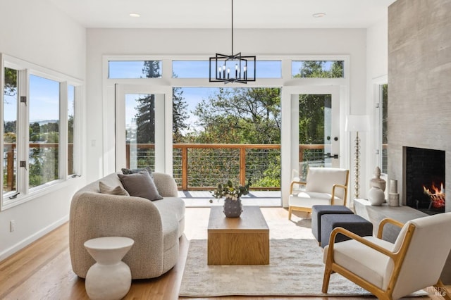 sunroom / solarium with a chandelier