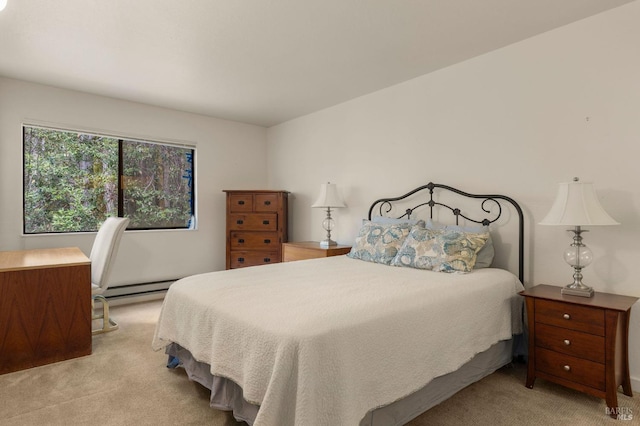 carpeted bedroom featuring baseboard heating