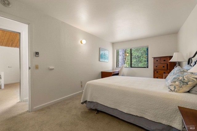 carpeted bedroom with baseboards
