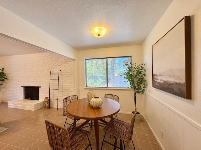 dining area with a textured ceiling