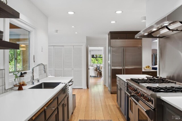 15 Glen Dr, Mill Valley, CA 94941 - kitchen with ventilation hood, recessed lighting, light countertops, a sink, and high quality appliances