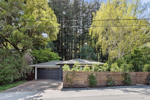 15 Glen Dr, Mill Valley, CA 94941 - exterior space featuring concrete driveway, an attached garage, and a fenced front yard
