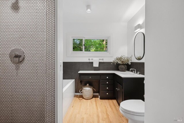 15 Glen Dr, Mill Valley, CA 94941 - bathroom featuring vanity, toilet, a shower, wood finished floors, and a freestanding bath