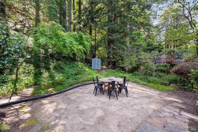 15 Glen Dr, Mill Valley, CA 94941 - view of patio with a storage shed, an outdoor structure, and outdoor dining area