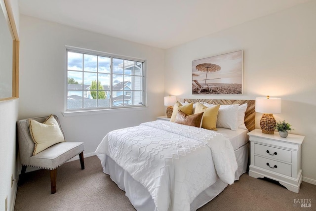 carpeted bedroom with baseboards