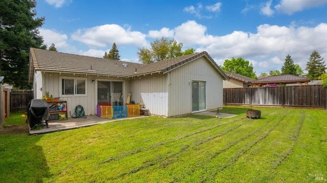 1864 Quail Meadows Cir, Vacaville, CA 95687 - rear view of property with a fenced backyard, a tile roof, and a lawn