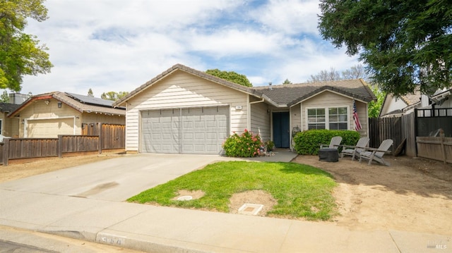1864 Quail Meadows Cir, Vacaville, CA 95687 - view of front facade with an attached garage, concrete driveway, and fence
