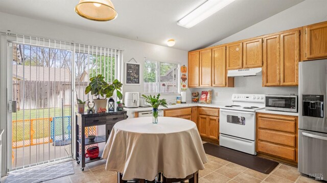 1864 Quail Meadows Cir, Vacaville, CA 95687 - kitchen with a sink, light countertops, under cabinet range hood, stainless steel appliances, and lofted ceiling