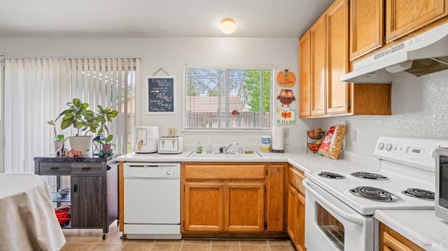 1864 Quail Meadows Cir, Vacaville, CA 95687 - kitchen with under cabinet range hood, white appliances, light countertops, and a sink