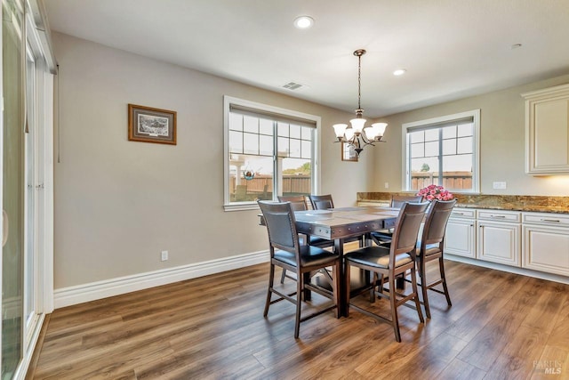 dining room with baseboards, an inviting chandelier, recessed lighting, dark wood-style floors, and visible vents