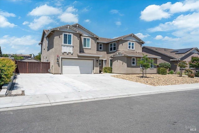 1012 Capitola Ct, Vacaville, CA 95687 - view of front of property with an attached garage, stucco siding, and driveway