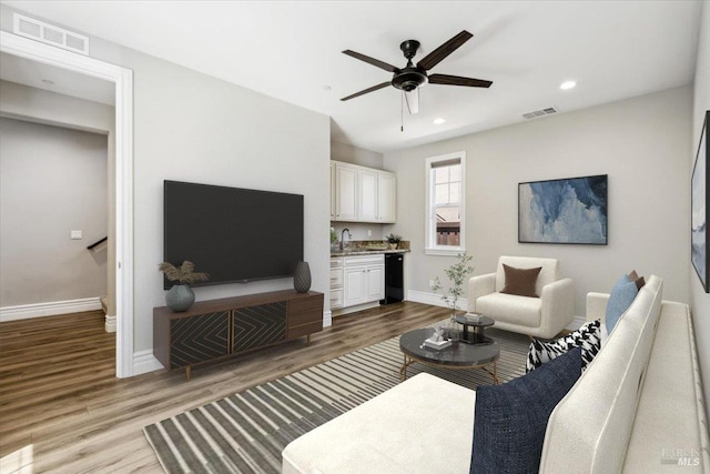 1012 Capitola Ct, Vacaville, CA 95687 - living area featuring wood finished floors, ceiling fan, and recessed lighting