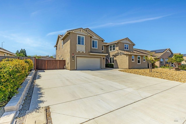 craftsman-style house with a residential view, stucco siding, driveway, a garage, and fence
