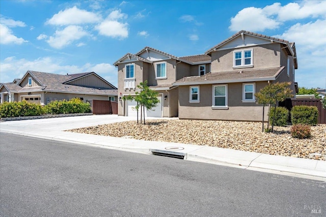 1012 Capitola Ct, Vacaville, CA 95687 - view of front of house with concrete driveway, stucco siding, and an attached garage