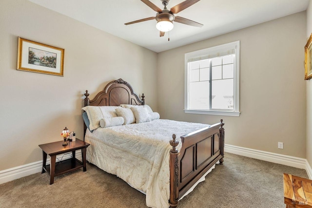 bedroom with light carpet, baseboards, and a ceiling fan