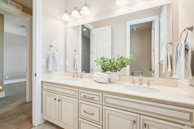 1012 Capitola Ct, Vacaville, CA 95687 - bathroom featuring double vanity and toilet