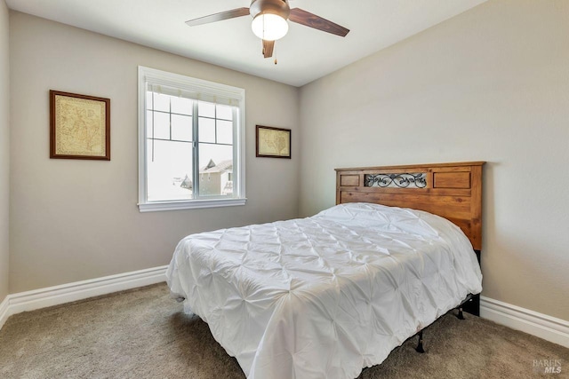 carpeted bedroom with baseboards and ceiling fan