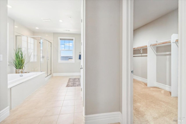 1012 Capitola Ct, Vacaville, CA 95687 - bathroom featuring a shower stall, a spacious closet, a bath, tile patterned flooring, and recessed lighting