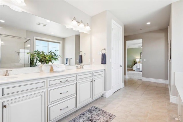 1012 Capitola Ct, Vacaville, CA 95687 - full bath with double vanity, ensuite bathroom, a shower stall, recessed lighting, and ceiling fan