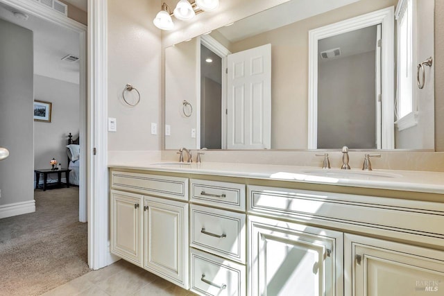 bathroom featuring double vanity, a sink, and visible vents