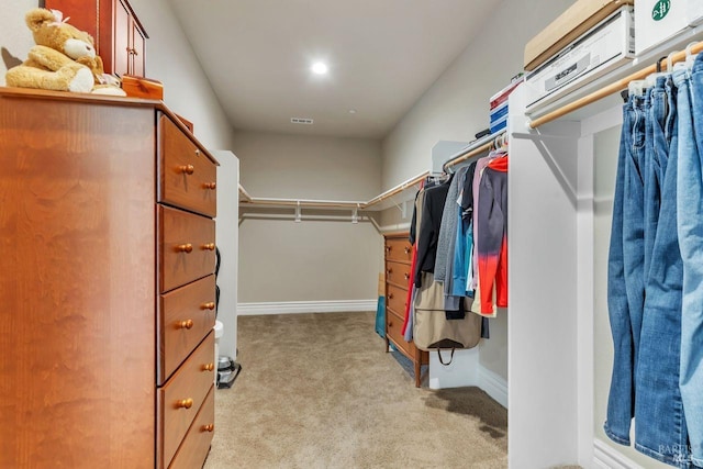 spacious closet with carpet floors and visible vents