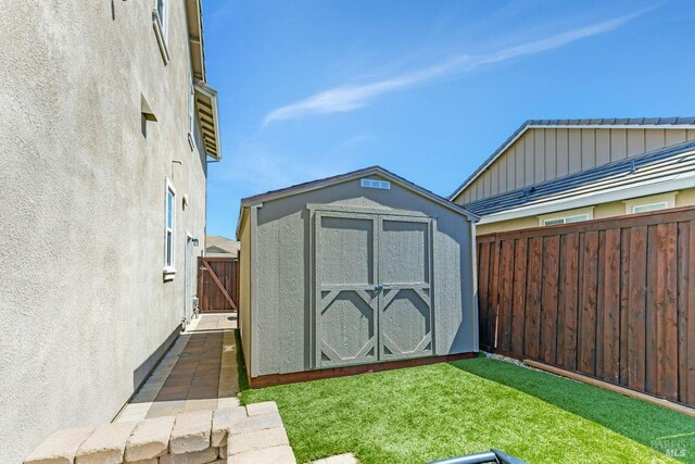 view of shed with a fenced backyard