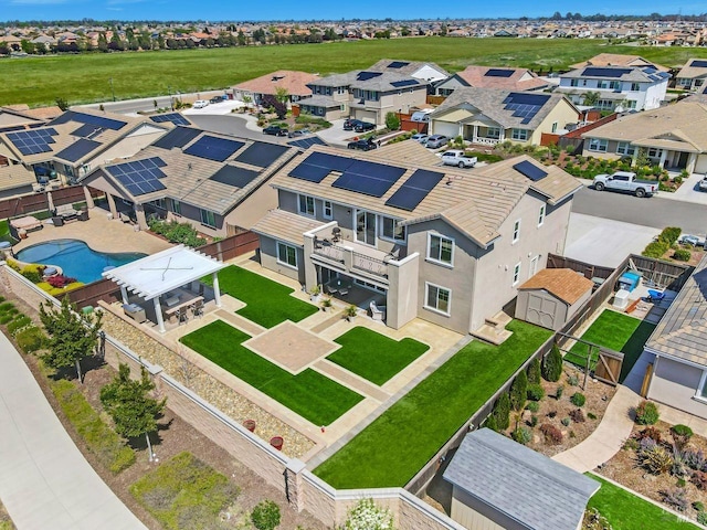 birds eye view of property with a residential view