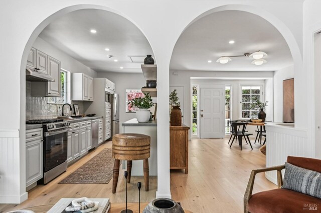 354 Forrest Ave, Fairfax, CA 94930 - kitchen with appliances with stainless steel finishes, under cabinet range hood, healthy amount of natural light, light wood finished floors, and recessed lighting