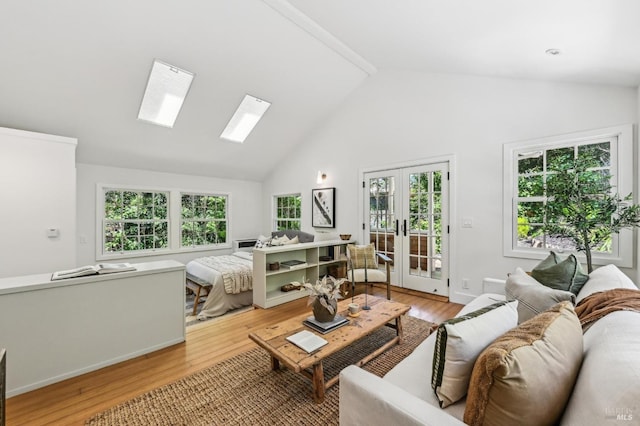 354 Forrest Ave, Fairfax, CA 94930 - living room featuring a skylight, high vaulted ceiling, light wood finished floors, and french doors