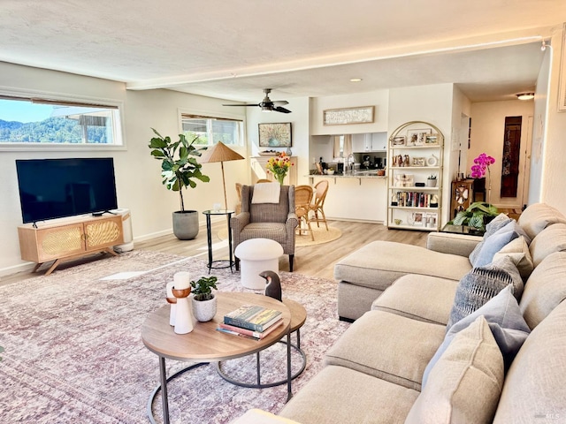 50 Via Belardo Unit 12, Greenbrae, CA 94904 - living area with light wood-style floors and ceiling fan