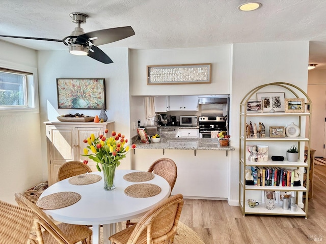 50 Via Belardo Unit 12, Greenbrae, CA 94904 - dining room with light wood-type flooring and ceiling fan