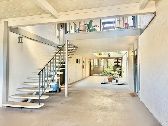 50 Via Belardo Unit 12, Greenbrae, CA 94904 - stairway featuring a textured wall, concrete floors, a high ceiling, and beamed ceiling