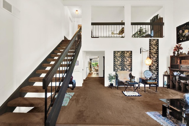 410 Duvall Ct, Benicia, CA 94510 - stairs with a towering ceiling, visible vents, and carpet floors