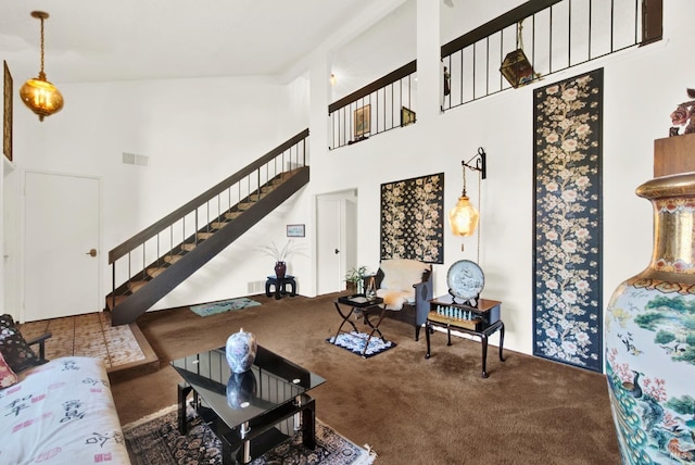 410 Duvall Ct, Benicia, CA 94510 - carpeted living area with a towering ceiling, visible vents, and stairs