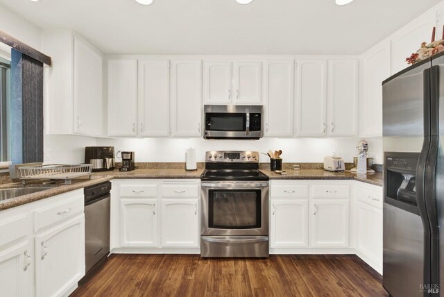 410 Duvall Ct, Benicia, CA 94510 - kitchen with dark wood-type flooring, white cabinets, and stainless steel appliances