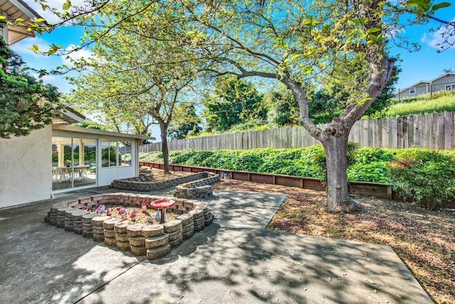 410 Duvall Ct, Benicia, CA 94510 - view of patio featuring an outdoor fire pit and a fenced backyard