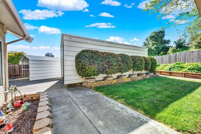 410 Duvall Ct, Benicia, CA 94510 - view of yard with a patio, a carport, and fence private yard