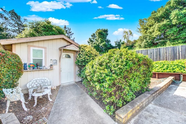410 Duvall Ct, Benicia, CA 94510 - view of exterior entry with board and batten siding and fence