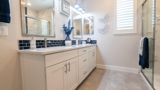 324 Pear Tree Ter Unit D, Napa, CA 94558 - bathroom featuring a stall shower, double vanity, baseboards, and decorative backsplash