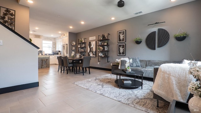 living area featuring baseboards, recessed lighting, visible vents, and light tile patterned floors