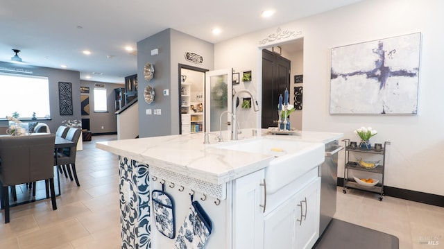 324 Pear Tree Ter Unit D, Napa, CA 94558 - kitchen with light stone counters, white cabinetry, stainless steel dishwasher, light tile patterned floors, and recessed lighting