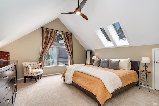 1206 Cayetano Dr, Napa, CA 94559 - bedroom with a ceiling fan, vaulted ceiling with skylight, light carpet, baseboards, and visible vents