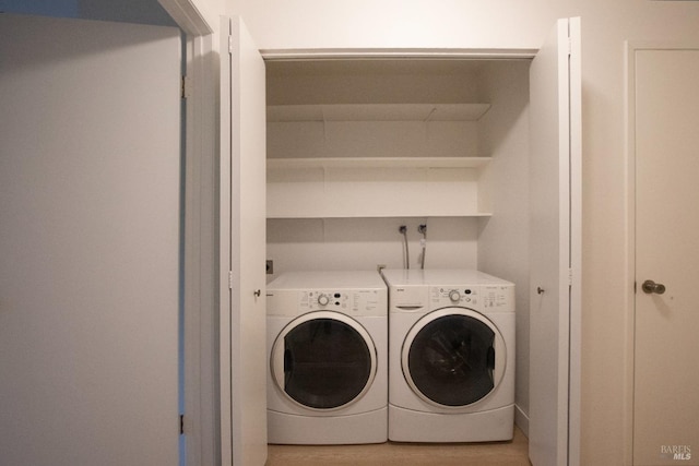 laundry area with washer and dryer and laundry area
