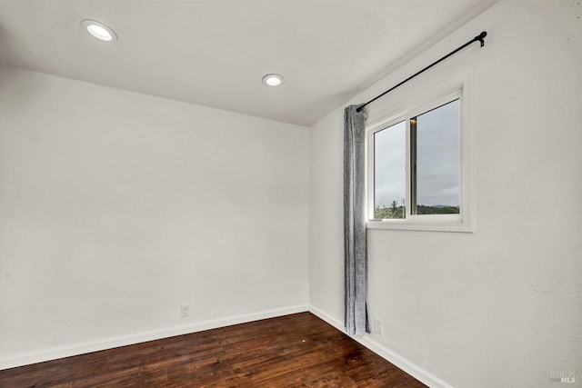 unfurnished room with recessed lighting, baseboards, and dark wood-style flooring