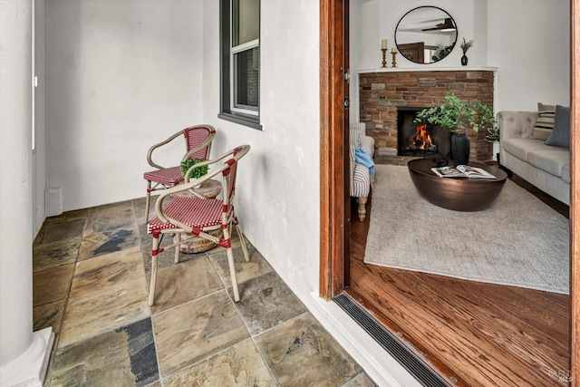 interior space featuring a stone fireplace