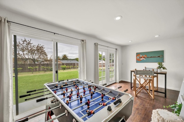 game room featuring recessed lighting, wood finished floors, and baseboards