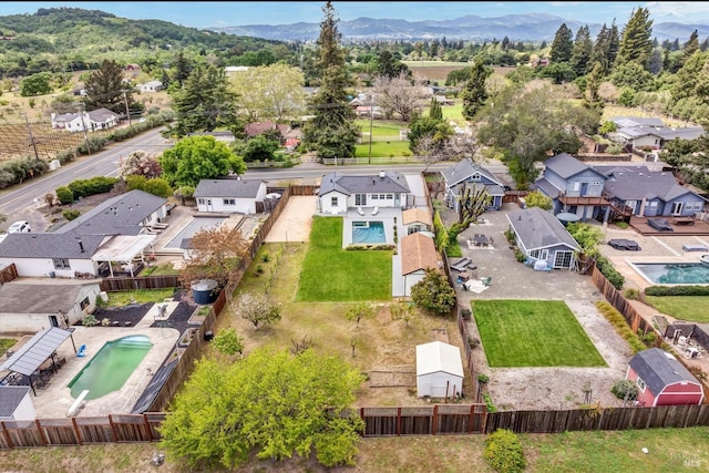birds eye view of property with a residential view and a mountain view