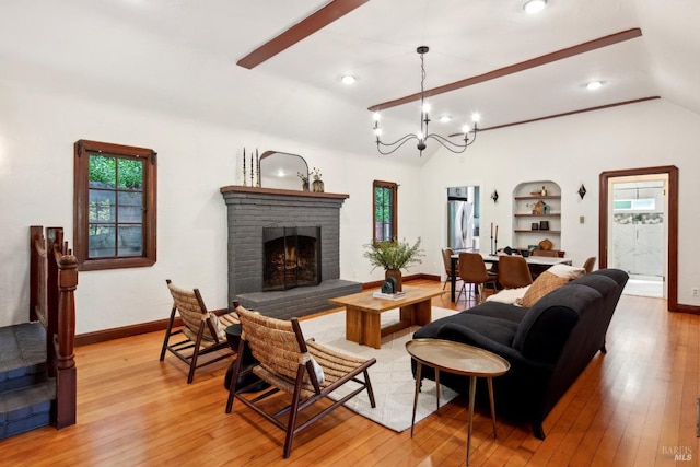 12 Jones Way, Larkspur, CA 94939 - living room with a fireplace, built in shelves, light wood-type flooring, and vaulted ceiling