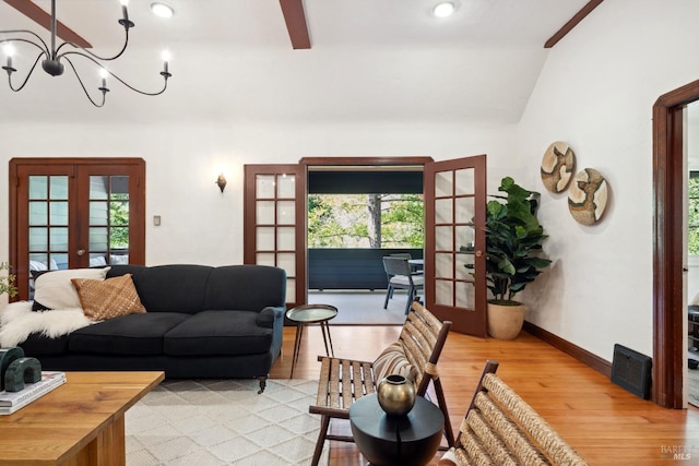 12 Jones Way, Larkspur, CA 94939 - living room with light wood-type flooring, baseboards, french doors, lofted ceiling, and ceiling fan with notable chandelier